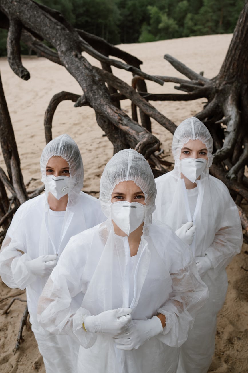 People in protective hazmat suits illustrating the danger and moral considerations